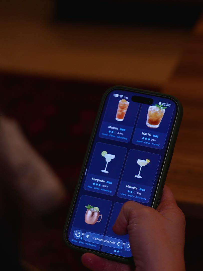 A guest's phone showing the venue's cocktail menu
